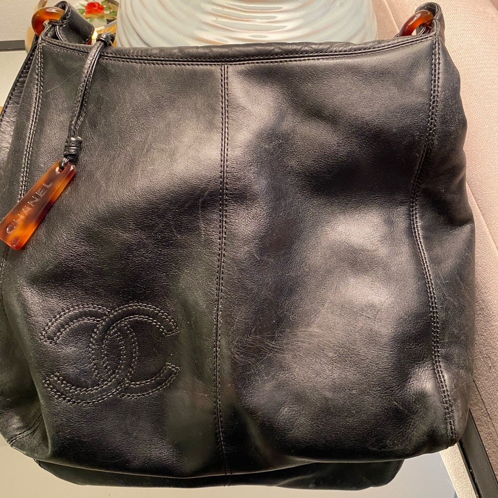 Chanel Rare tasteful understated embossed bag with tortoise shell accent.